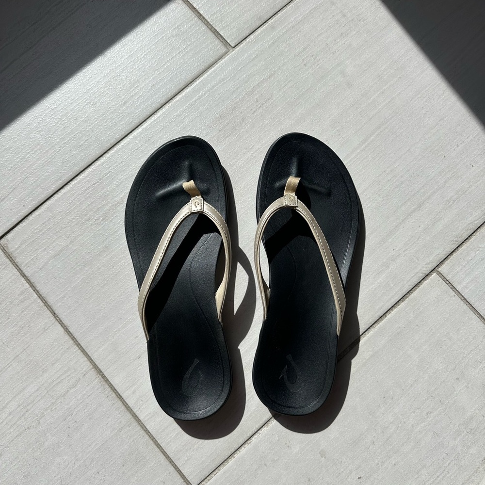 OluKai Women's Black and Gold Flip Flops